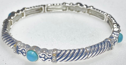 FASHION JEWELRY Turquoise, on a stretched ban with the twisted look an antique finishing and silver highlights