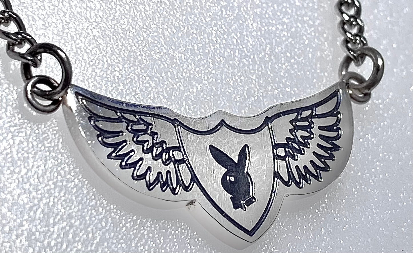 Playboy Bunny Wing Head Finish with Black Color on a Curb Chain